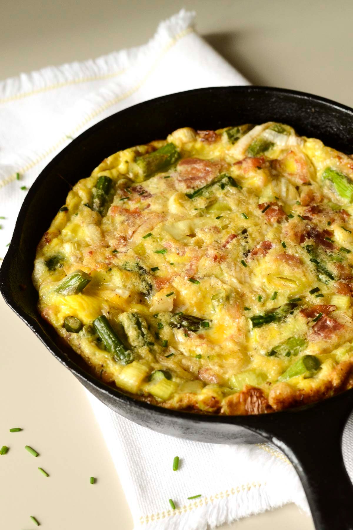 This Asparagus Leek Frittata is a delicious celebration of spring vegetables. Great recipe for breakfast, lunch, or dinner!